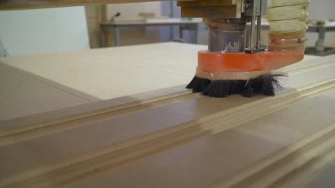 The CNC machine is working. Close-up of a numerical control machine cuts a tr Stock Photos