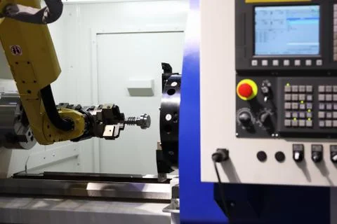CNC machining center with collaborative robot Stock Photos