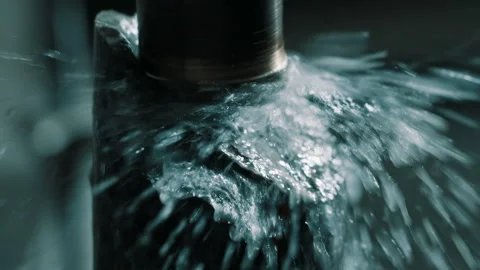 CNC Machining Close-Up: Cutting Fluid Splash Around Rotating Metal Tool Stock Footage 337926953