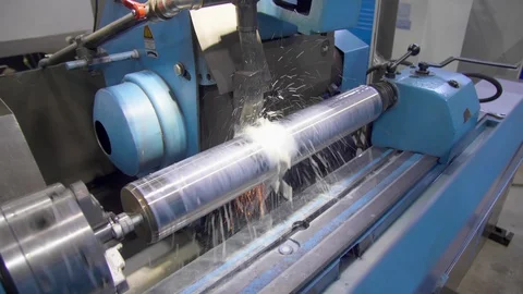 CNC metal grinding machine. Make the steel part smooth to shine. Sparks during Stock Footage 128821402