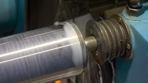CNC metal grinding machine. Make the steel part smooth to shine. Sparks during Stock Footage 128822667