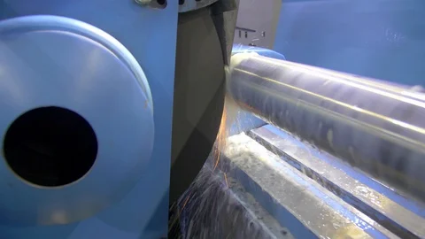 CNC metal grinding machine. Make the steel part smooth to shine. Sparks during Stock Footage 128822941