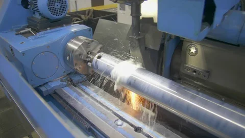 CNC metal grinding machine. Make the steel part smooth to shine. Sparks during Stock Footage 129099692