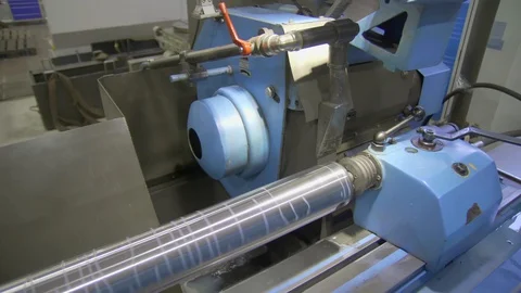 CNC metal grinding machine. Make the steel part smooth to shine. Sparks during Stock Footage 129100060