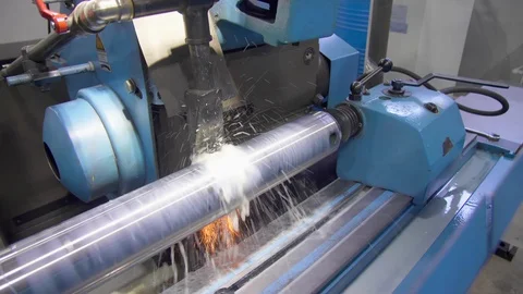 CNC metal grinding machine. Make the steel part smooth to shine. Sparks during Video stock 129845948