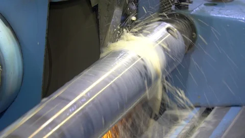 CNC metal grinding machine. Make the steel part smooth to shine. Sparks during Video stock 129847506