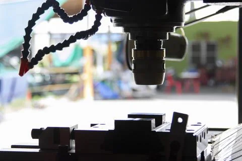 CNC miling of cutting face of raw material Stock Photos