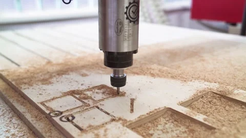 CNC milling machine cutting pattern on plywood sheet. CNC fraser cutting on wood Video stock 164548796