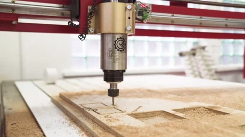 CNC milling machine cutting pattern on plywood sheet. CNC fraser cutting on wood Stock-Footage 164548824