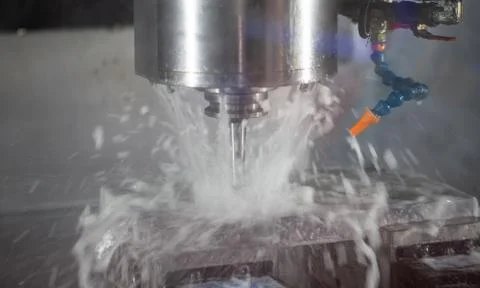 CNC milling machine cutting workpiece Stock Photos
