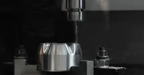 CNC milling machine makes some steel part on a factory Stock Footage 87864731