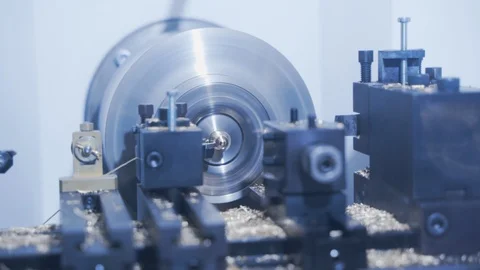 CNC milling machine makes some steel part on a factory Stock Footage 107780253