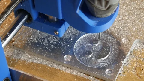 CNC Milling Machine Mills Smiley Face In Aluminium Workshop Stock Footage 114124929