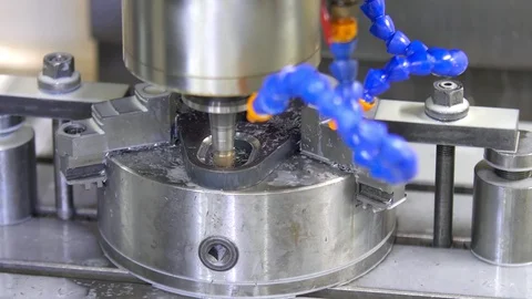 CNC milling machine in operation. Manufacturing of metal parts. Close-up Stock Footage 128811069