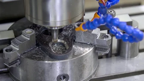 CNC milling machine in operation. Manufacturing of metal parts. Close-up Stock Footage 128811396