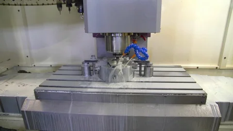 CNC milling machine in operation. Manufacturing of metal parts. Steadycam. Stock Footage 129843551