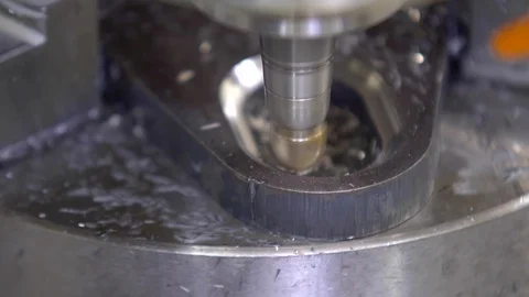 CNC milling machine in operation. Manufacturing of metal parts. Close-up Video stock 129844974
