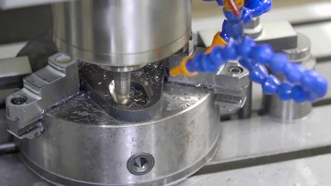 CNC milling machine in operation. Manufacturing of metal parts. Close-up Video stock 129845421