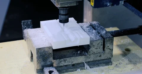 Cnc milling machine. Processing and cutting of parts from a piece of metal in Stock Footage 111567166