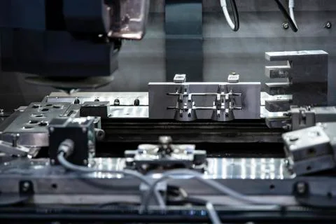 Cnc milling machine. Processing and cutting of parts from a piece of metal in Stock Photos