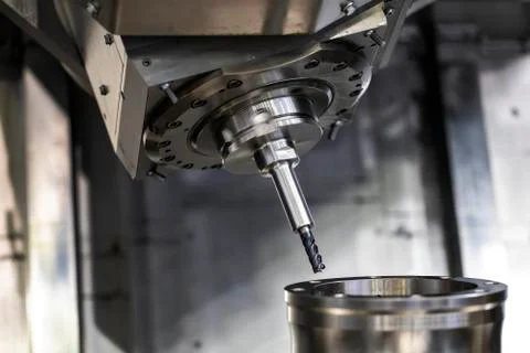 Cnc milling machine. Processing and cutting of parts from a piece of metal in Stock Photos