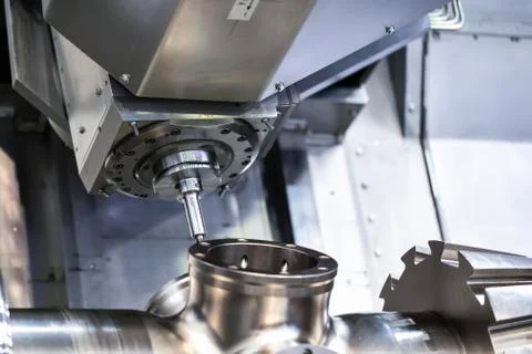 Cnc milling machine. Processing and cutting of parts from a piece of metal in Stock Photos