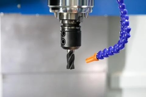 CNC milling machine spindle with roughing end mill Stock Photos