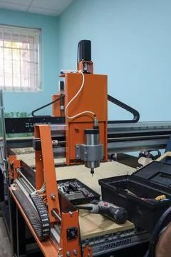 CNC milling machine with tools and workspace in a workshop setting Stock Photos
