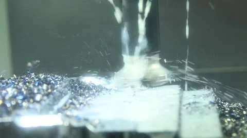 CNC milling machine work. Coolant and lubrication in gear metalwork industry Stock Footage 131397150