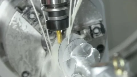 CNC milling machine work. metal processing with coolant Stock Footage 154928463
