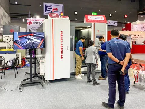 CNC milling machine working show it to customers in Metalex exhibition Stock Photos