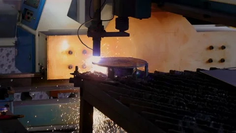 CNC operated Plasma cutting machine cutting metal sheet in a factory Stock Footage 168169101