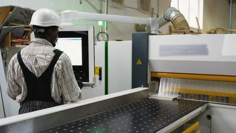 CNC Operator Cutting OSB Sheets in Wood Factory Stock Footage 305599345