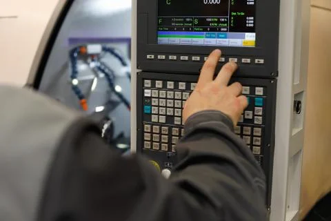 CNC operator programming lathe machine Stock Photos