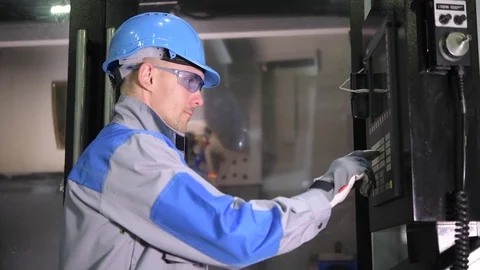 CNC Operator Scheduling Metal Processing on the Machine Monitoring System Stock Footage 84941141