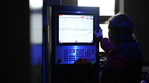 CNC Operator Working on Industrial Machine Panel Video stock 306682470
