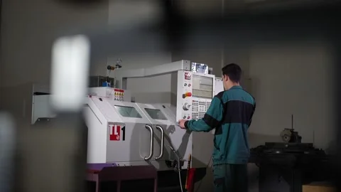 CNC Operator Working on Industrial Machine Panel Stock Footage 306749008