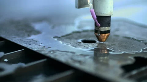 CNC plasma cutter that is cutting out metal objects in a heavy industry factory Stock Footage 68905019