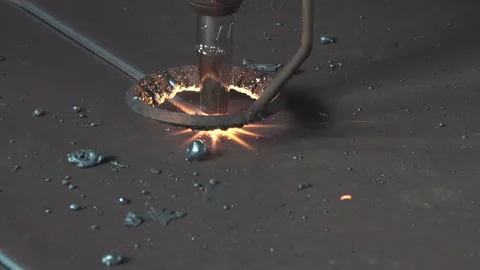 CNC plasma cutter torch moves and arc cuts metal. Stock Footage 138689462