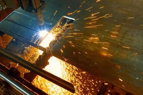 CNC plasma cutting machine cuts a metal sheet Stock Photos