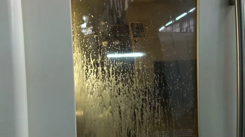 CNC. Processing metal elements with cnc machine. Fluid trickling down the glass. Stock Footage 49025515