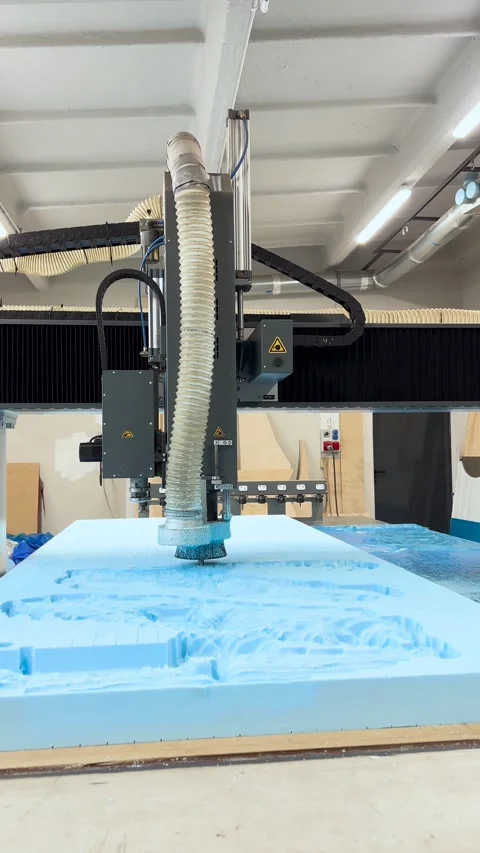 A CNC router performing rough milling of a sculpture in an extruded polysty.. Stock Footage 300866043