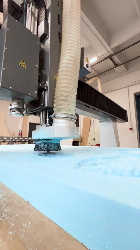 A CNC router performing rough milling of a sculpture in an extruded polysty.. Stock Footage 300866062