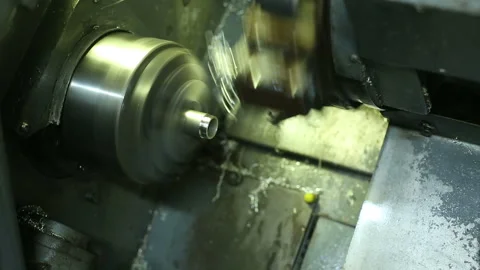 Cnc silver bar cutting lathe. silver ring production. industrial precision Stock Footage 139601275