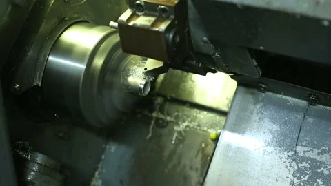 Cnc silver bar cutting lathe. silver ring production. industrial precision cut Stock Footage 139601279