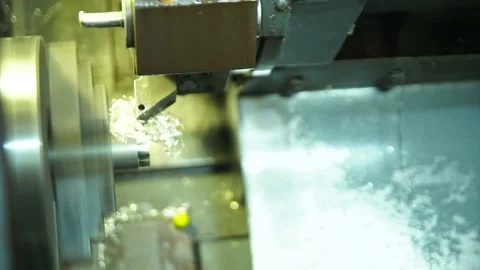 Cnc silver bar cutting lathe. silver ring production. industrial cutting Stock Footage 139655279