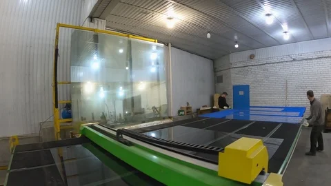 CNC strut for automatic cutting and overcutting of flat polished glass at work. Stock-Footage 124282849