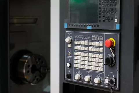 CNC turning machine and control panel close up Stock Photos