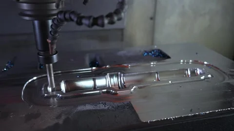 CNC turning machine high precision throwing coolant liquid on metal component in Stock Footage 331133805