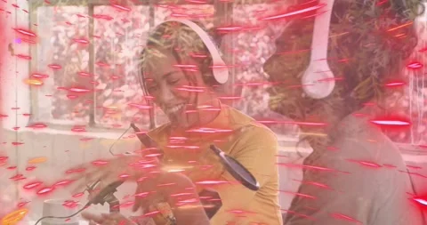 Co-hosts tapping desk mic for podcast check confirming levels adjusting knob and Stock Footage 316890185